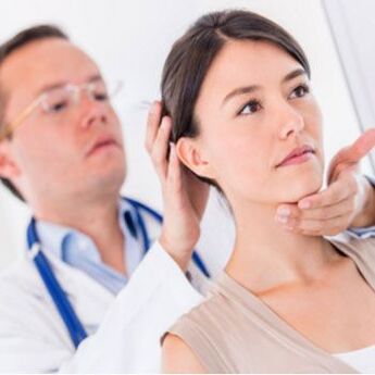 The neurologist examines the patient whose neck hurts